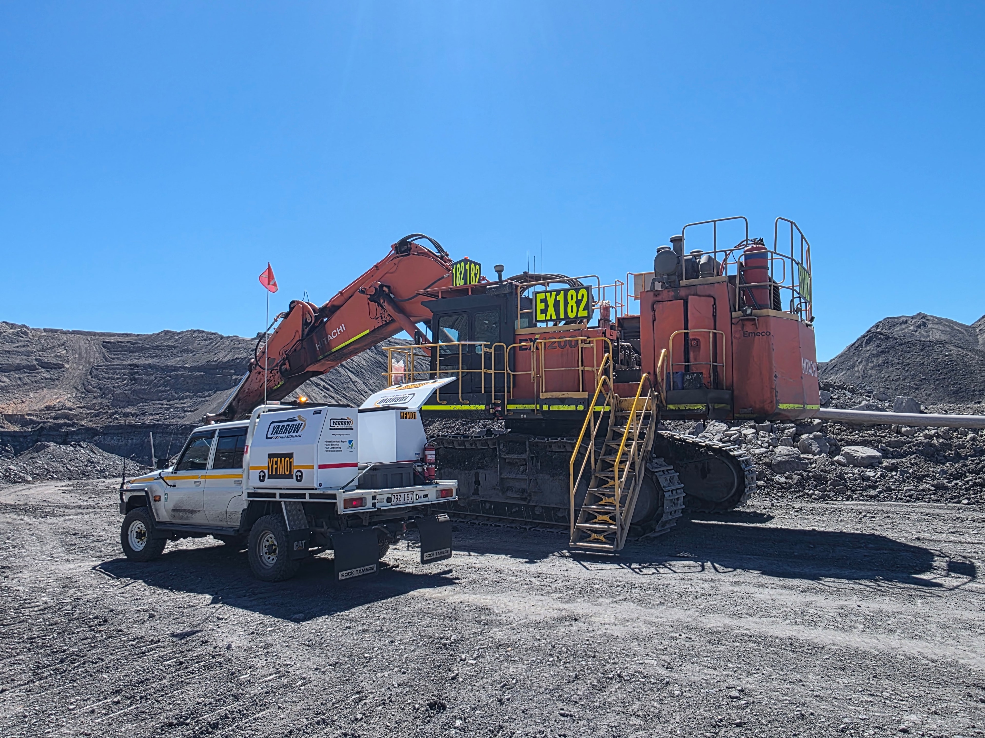 Mobile mechanic and excavator at quarry site — on-site diesel repairs Queensland